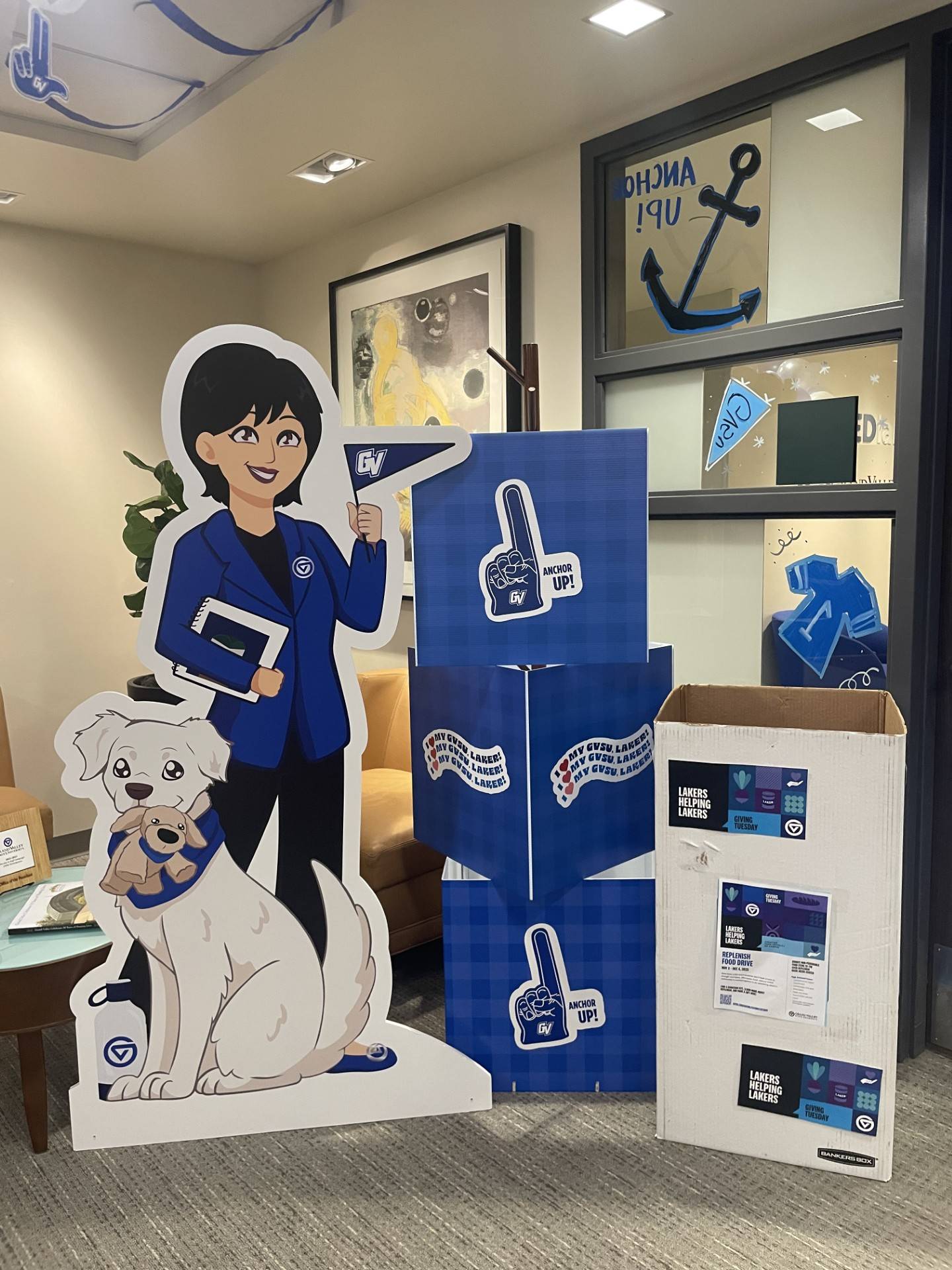 President's Office Homecoming decor, Philly and Lily figurines next to a food donation box